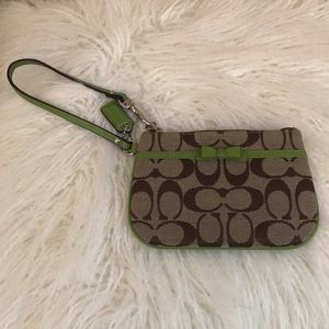 CURRENTLY ON HOLD!Never Used Coach wrist wallet.